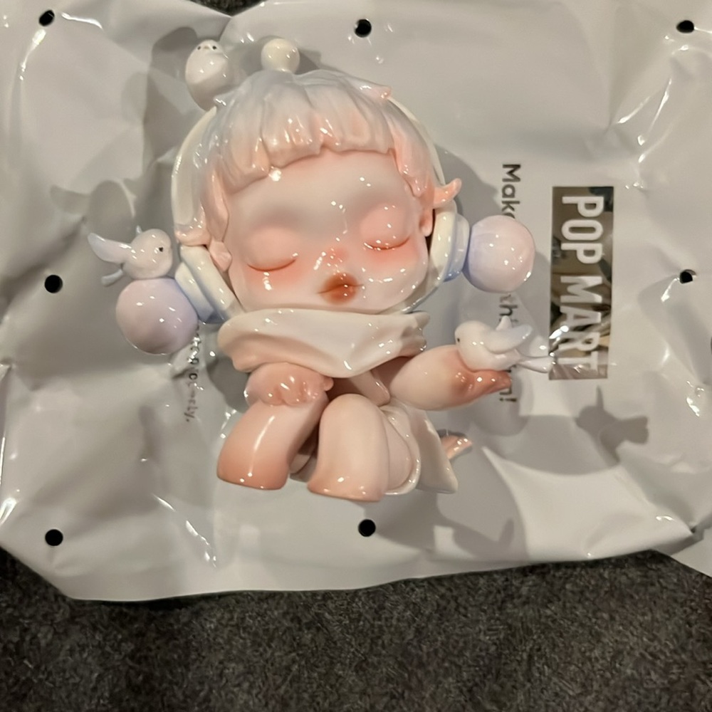 Popmart Skullpanda The Warmth series “chirping” figure.